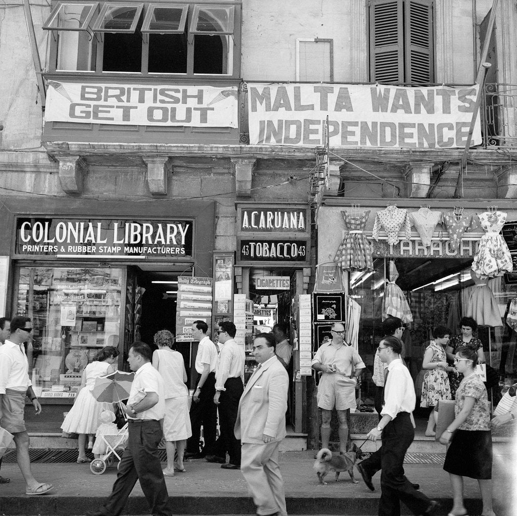 Detail of A view of shops with anti-British and pro-Independence signs, possibly on Kings Street, Valetta, Malta. by Marine Photo Service