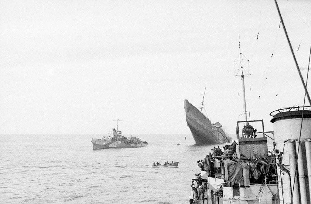 Detail of Photograph of Windsor Castle (1922) sinking in 1943,  distant port bow view with bow high in the air and escort destroyer 'Farndale' (1940) standing by 'Eskimo' in foreground by Lt JE Manners