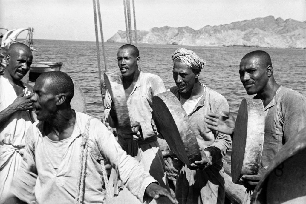 Detail of The musical crew of the 'Triumph of Righteousness' sailing into Mutrah Harbour, Oman by Alan Villiers
