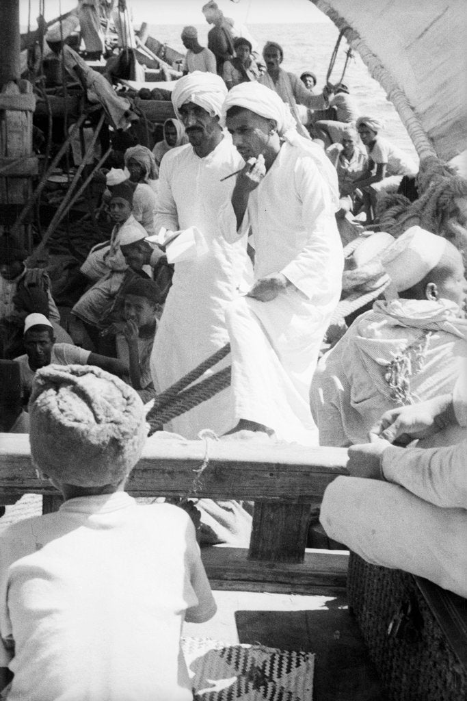 Detail of Nejdi and the mate, Hamed bin Salim, check passengers from Hadramuaut crowded on board the 'Triumph' by Alan Villiers