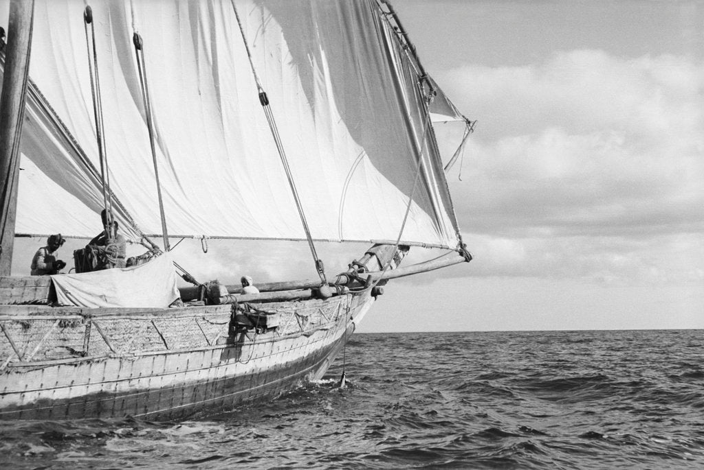 Detail of The tack of fore-foot of the mainsail with, behind it, a jib set on a spar, on a boom under full sail by Alan Villiers